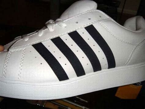 4 stripe fake adidas|shoe with four stripes.